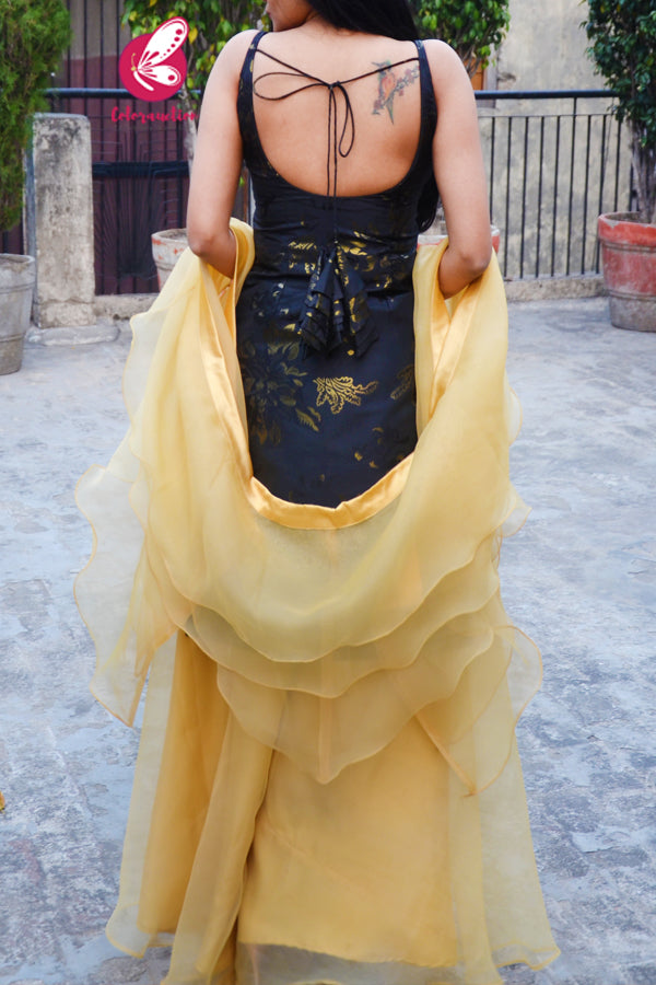 Black Golden Brocade Padded Knee Length Side Slit Kurti with Golden Organza Sharara Paired with Golden Organza Three-Tier Ruffle Stole